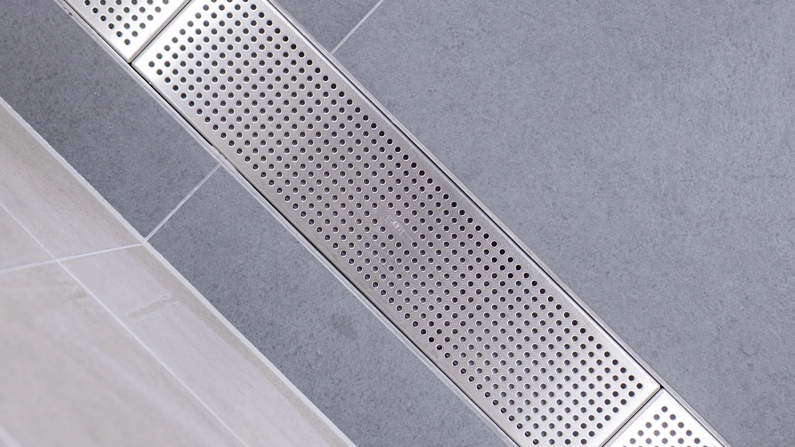 Renovated shower spaces at Wembley Stadium now featuring frost linear drainage systems.
