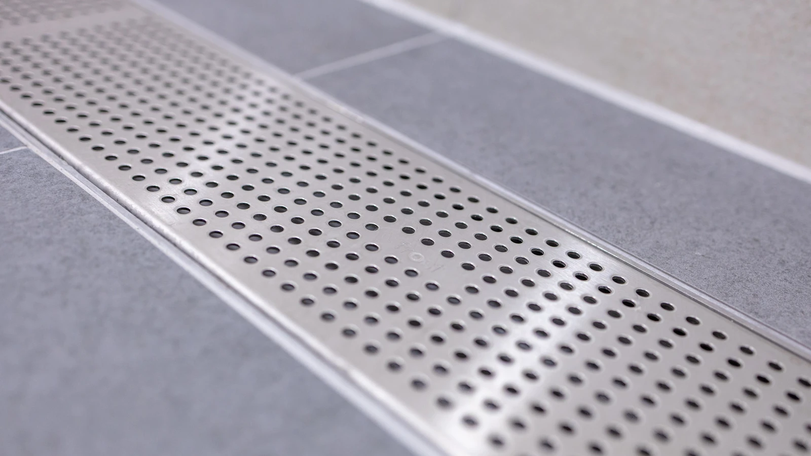 Refined shower rooms at Wembley Stadium with frost linear drainage installations.