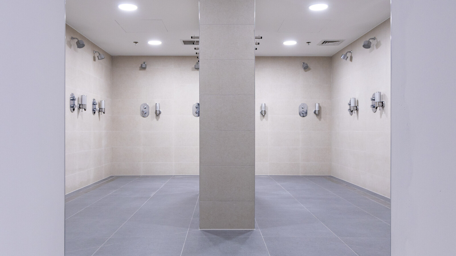 Modernized Wembley Stadium shower rooms featuring newly installed frost linear drainage.