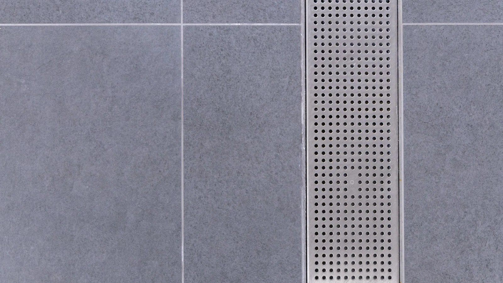 Renovated shower facilities at Wembley Stadium with advanced frost linear drainage systems.