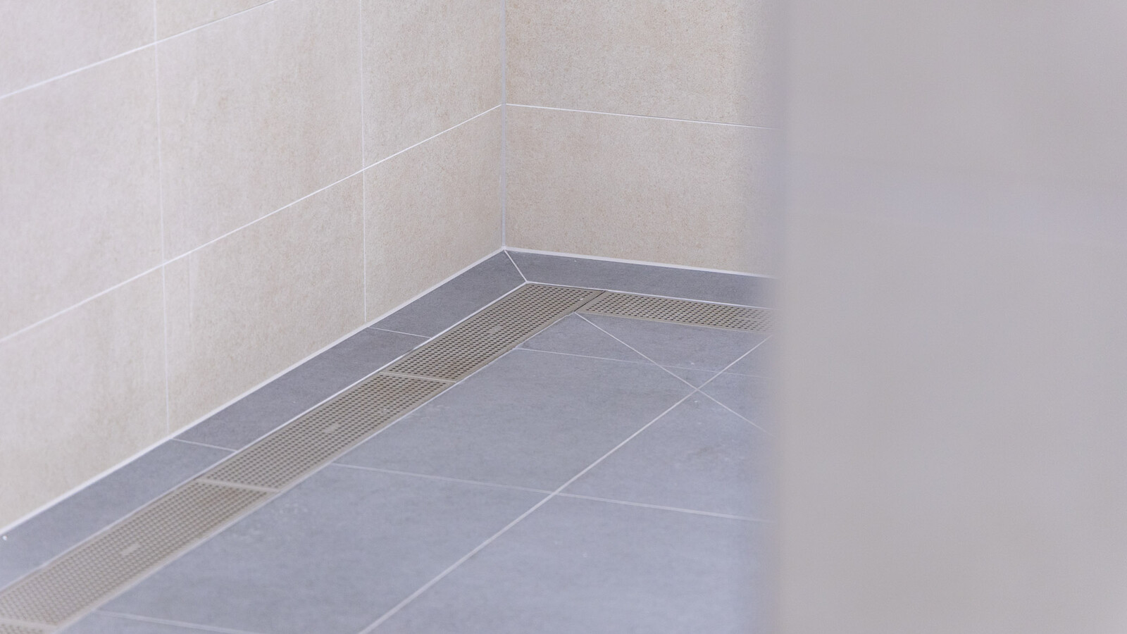Wembley Stadium’s upgraded shower rooms with sleek frost linear drainage installed.