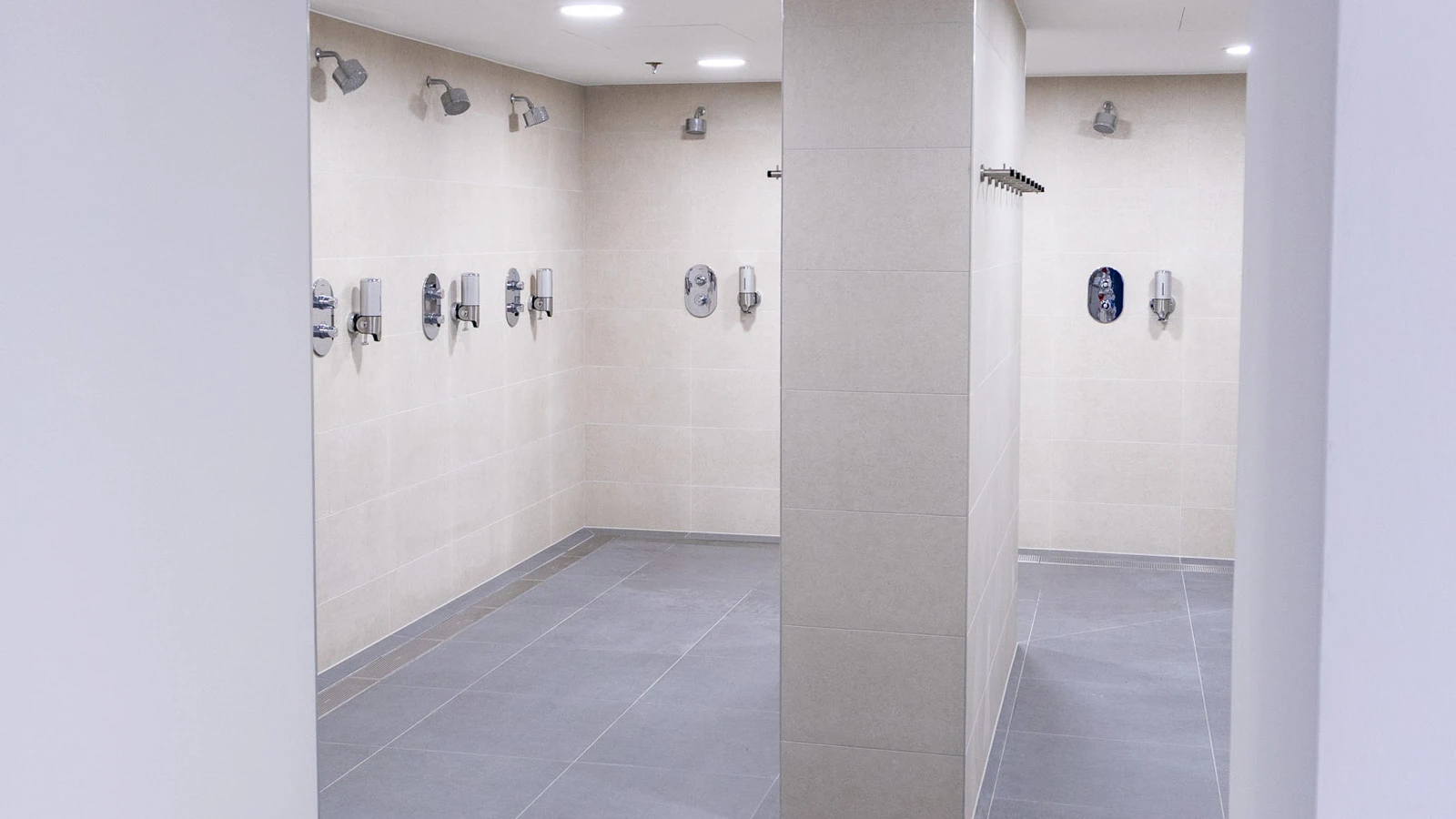 Updated shower rooms at Wembley Stadium showcasing state-of-the-art frost linear drainage.