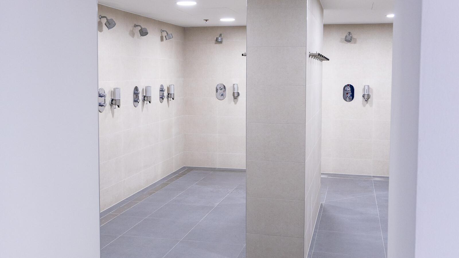 Updated shower rooms at Wembley Stadium showcasing state-of-the-art frost linear drainage.