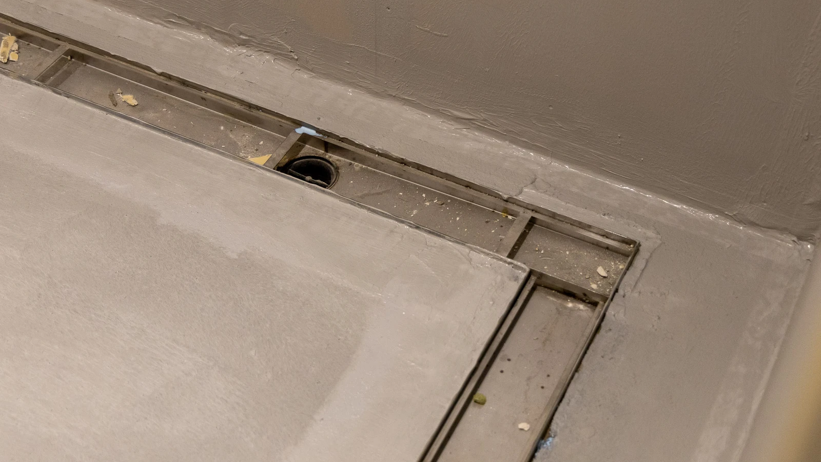Detail shot of Frost linear drainage integrated into the flooring at Wembley Stadium.