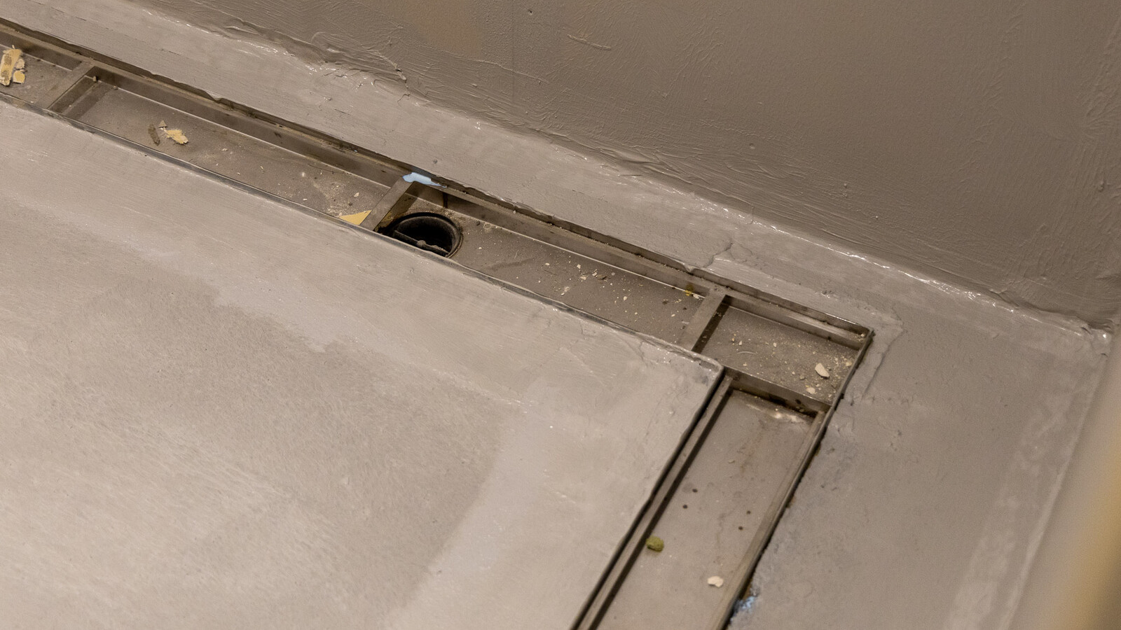 Detail shot of Frost linear drainage integrated into the flooring at Wembley Stadium.