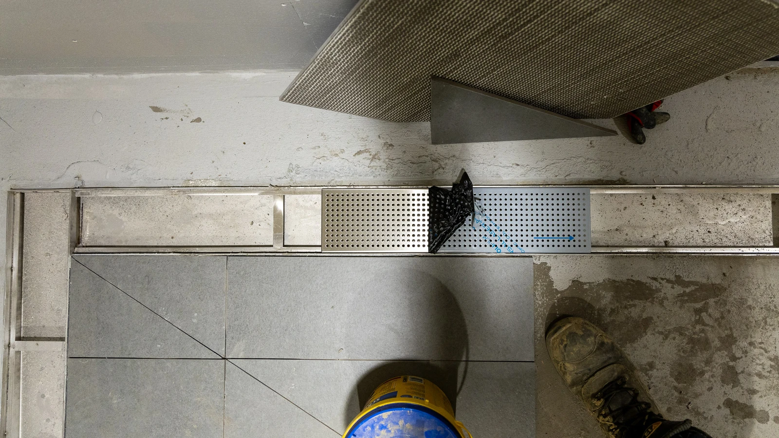 A sleek Frost linear drain embedded in the flooring at Wembley’s changing rooms.