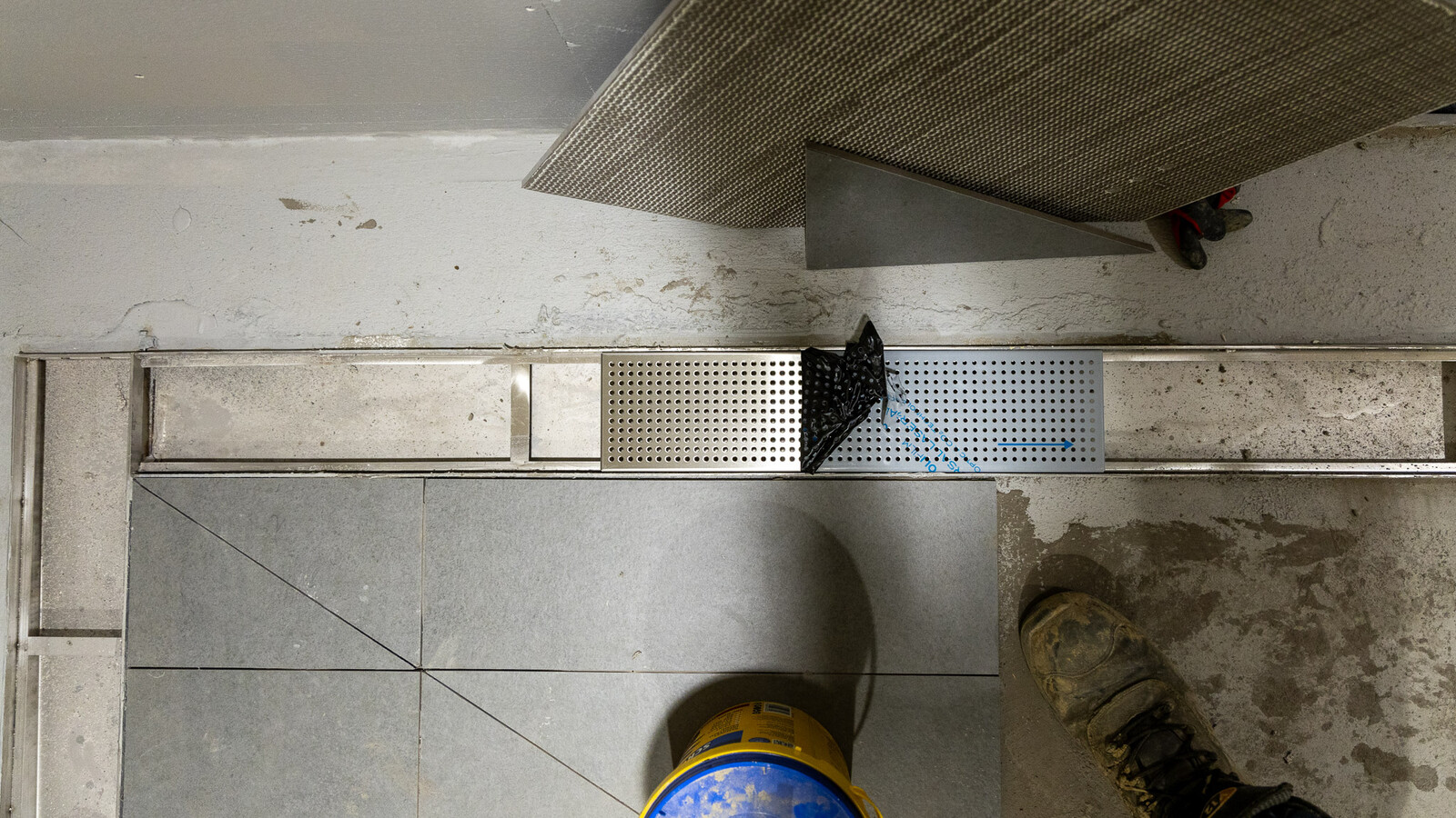 A sleek Frost linear drain embedded in the flooring at Wembley’s changing rooms.