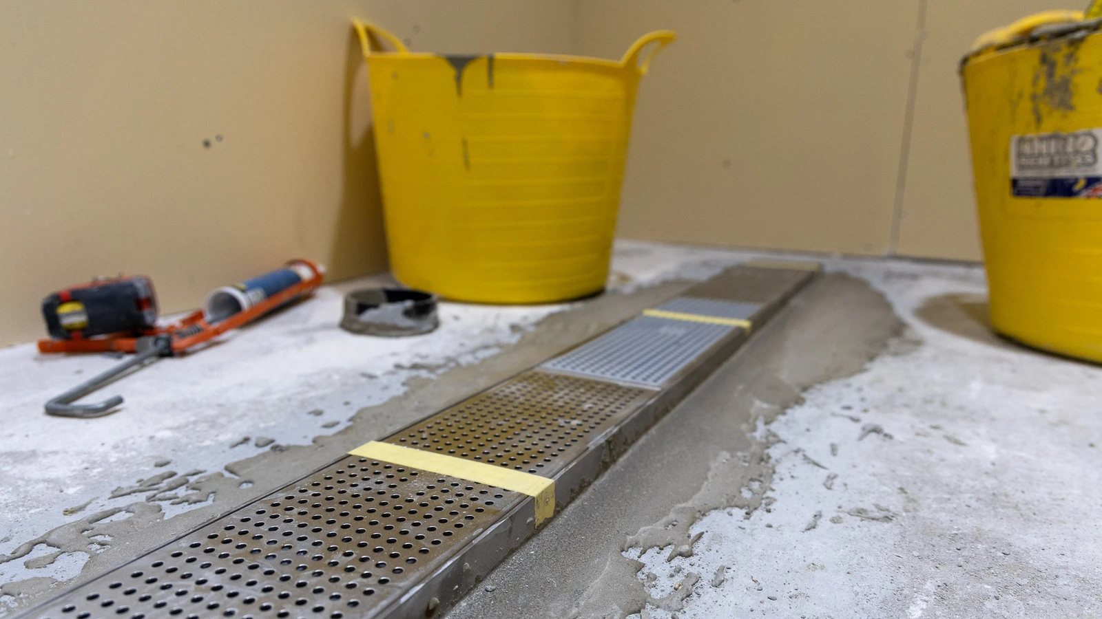 Frost linear drainage system in the ball boys' shower rooms at Wembley, mid-construction.