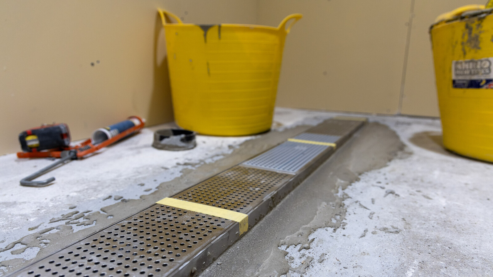 Frost linear drainage system in the ball boys' shower rooms at Wembley, mid-construction.