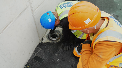 Coinford construction worker installing Frost roof drain 